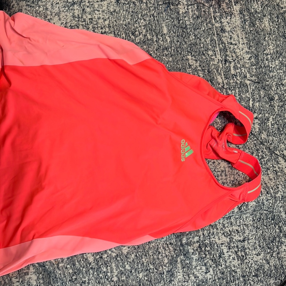 Adidas tennis tank. Size xl.  Orange. White netting. Has bra built in.